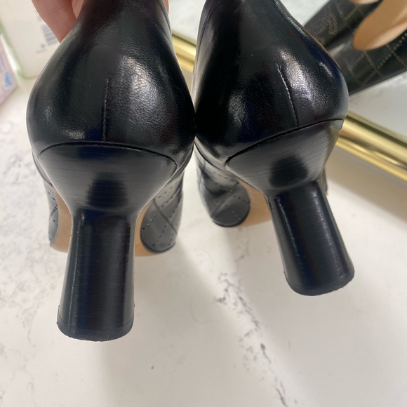 Gorgeous CHANEL heels black with bone colored quilting and CC monogram at toes. - Picture 13 of 13